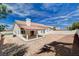 Spacious backyard featuring a covered patio perfect for relaxing and outdoor gatherings at 7927 W Oquendo Rd, Las Vegas, NV 89113
