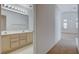 Double sink bathroom with well-lit vanity and neutral tile flooring at 7927 W Oquendo Rd, Las Vegas, NV 89113