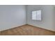 Cozy carpeted bedroom with a bright window and neutral walls at 7927 W Oquendo Rd, Las Vegas, NV 89113