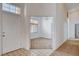 Inviting entryway with tiled floors and a bright view into the living space at 7927 W Oquendo Rd, Las Vegas, NV 89113
