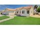 Charming single-story home with a well-maintained front lawn, desert landscaping, and a two-car garage at 7927 W Oquendo Rd, Las Vegas, NV 89113