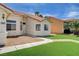 Charming single-story home with a well-maintained front lawn, desert landscaping, and a two-car garage at 7927 W Oquendo Rd, Las Vegas, NV 89113