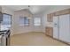 Bright kitchen with classic appliances, ample cabinet space, and breakfast nook area at 7927 W Oquendo Rd, Las Vegas, NV 89113