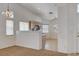 Bright kitchen area features a breakfast bar and views into the dining area at 7927 W Oquendo Rd, Las Vegas, NV 89113