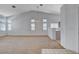 Spacious living room features vaulted ceilings and neutral carpet throughout the space at 7927 W Oquendo Rd, Las Vegas, NV 89113