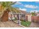 Relaxing backyard space featuring a covered pergola, artificial grass, and mature landscaping at 8136 Shady Glen Ave, Las Vegas, NV 89131