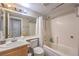 Clean bathroom featuring a shower-tub combination and a single-sink vanity with cabinet storage at 8136 Shady Glen Ave, Las Vegas, NV 89131