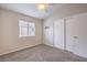 Neutral bedroom with vaulted ceilings, carpet, and a double-door closet at 8136 Shady Glen Ave, Las Vegas, NV 89131