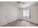 Bedroom with carpet, a ceiling fan, a window with blinds, and a closet at 8136 Shady Glen Ave, Las Vegas, NV 89131