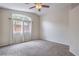 Bright bedroom with carpet, a large window, and neutral paint, creating a relaxing atmosphere at 8136 Shady Glen Ave, Las Vegas, NV 89131