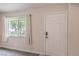 This entryway is bright and airy, with a modern smart lock on the door at 8136 Shady Glen Ave, Las Vegas, NV 89131