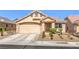 Charming single-story home featuring a two-car garage, desert landscaping, and a welcoming front entrance at 8136 Shady Glen Ave, Las Vegas, NV 89131