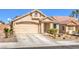 Charming single-story home featuring a two-car garage, manicured landscaping, and a welcoming front entrance at 8136 Shady Glen Ave, Las Vegas, NV 89131