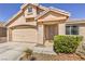 Well-maintained home exterior features a two-car garage, manicured landscaping, and a welcoming entrance with excellent curb appeal at 8136 Shady Glen Ave, Las Vegas, NV 89131