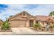 Charming single-story home with a well-manicured lawn and attached two-car garage at 8136 Shady Glen Ave, Las Vegas, NV 89131