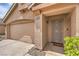 Inviting home exterior showcasing a two-car garage, desert landscaping, and a covered front porch at 8136 Shady Glen Ave, Las Vegas, NV 89131