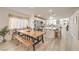 Bright kitchen features a dining area with a window seat, an island, and an open layout that promotes seamless living at 8136 Shady Glen Ave, Las Vegas, NV 89131