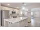 Bright kitchen features a center island, white cabinets, stainless steel appliances, and modern finishes at 8136 Shady Glen Ave, Las Vegas, NV 89131