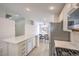 Bright kitchen featuring white countertops and cabinets, stainless steel appliances, and a view of the dining area at 8136 Shady Glen Ave, Las Vegas, NV 89131