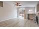 Inviting living room with a fireplace, sliding glass doors, and light-colored flooring at 8136 Shady Glen Ave, Las Vegas, NV 89131