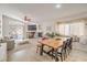 Spacious living area with a fireplace, dining area, and access to the outdoor patio at 8136 Shady Glen Ave, Las Vegas, NV 89131