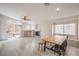 Spacious living area with a fireplace, dining space, and large windows for natural light at 8136 Shady Glen Ave, Las Vegas, NV 89131