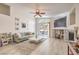 Bright living room with a cozy fireplace, modern furniture, and sliding glass doors to the patio at 8136 Shady Glen Ave, Las Vegas, NV 89131