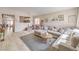 Comfortable living room with wood floors, neutral colors, modern furniture, and bright light at 8136 Shady Glen Ave, Las Vegas, NV 89131