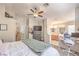 Main bedroom with a ceiling fan, workspace, ensuite bath, walk-in closet, neutral colors, and bright light at 8136 Shady Glen Ave, Las Vegas, NV 89131