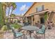 Backyard patio area with fire pit and mature landscaping at 8216 Brittany Harbor Dr, Las Vegas, NV 89128