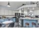 Modern kitchen featuring stainless steel appliances, an island with bar stools, and granite countertops at 8216 Brittany Harbor Dr, Las Vegas, NV 89128