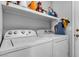 Bright laundry room with modern washer and dryer at 8216 Brittany Harbor Dr, Las Vegas, NV 89128