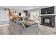 Living Room with modern fireplace, comfy seating, and sliding door to patio, creating a relaxing atmosphere at 8216 Brittany Harbor Dr, Las Vegas, NV 89128