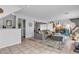Spacious living room with tile flooring, mural, and comfortable seating, perfect for relaxation and entertaining at 8216 Brittany Harbor Dr, Las Vegas, NV 89128