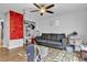Cozy living room with climbing wall, gray couch and ceiling fan at 8216 Brittany Harbor Dr, Las Vegas, NV 89128