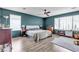 Large primary bedroom with fan, hardwood floors and natural light at 8216 Brittany Harbor Dr, Las Vegas, NV 89128