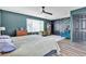 Spacious main bedroom featuring a ceiling fan and a large window at 8216 Brittany Harbor Dr, Las Vegas, NV 89128