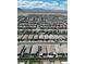 Expansive aerial view of a neighborhood showing tidy streets and uniform housing at 8724 Scalpay St, Las Vegas, NV 89166
