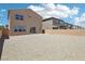 A spacious backyard offers a blank canvas for outdoor living with a blank slate pebble design at 8724 Scalpay St, Las Vegas, NV 89166