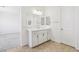 Bright bathroom featuring a vanity with storage and a large mirror at 8724 Scalpay St, Las Vegas, NV 89166