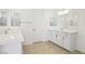 Bright bathroom with double sinks, quartz counters, and modern fixtures at 8724 Scalpay St, Las Vegas, NV 89166