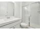 This bright bathroom features a stylish glass shower and a pristine white countertop sink at 8724 Scalpay St, Las Vegas, NV 89166
