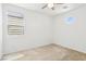 Bedroom with carpet flooring, a ceiling fan, and window with blinds at 8724 Scalpay St, Las Vegas, NV 89166