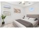Tastefully staged bedroom showcasing a comfortable bed, stylish decor, and a soothing ambiance at 8724 Scalpay St, Las Vegas, NV 89166