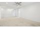 Open bedroom featuring neutral carpet and white trim, with versatile living space at 8724 Scalpay St, Las Vegas, NV 89166