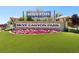 Community signage at Skye Canyon Park with colorful flower beds at 8724 Scalpay St, Las Vegas, NV 89166