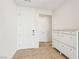 Foyer with a front door and cabinets for shoe storage at 8724 Scalpay St, Las Vegas, NV 89166