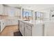 Open kitchen area with island and a view into the living space at 8724 Scalpay St, Las Vegas, NV 89166