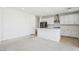 Open-concept kitchen featuring a large island, white cabinetry, and stainless steel appliances at 8724 Scalpay St, Las Vegas, NV 89166
