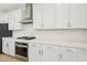 Modern kitchen featuring stainless steel appliances and white cabinets at 8724 Scalpay St, Las Vegas, NV 89166